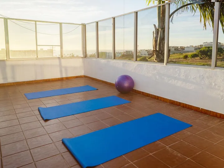 Outdoor yoga space with ocean view at Mind-U